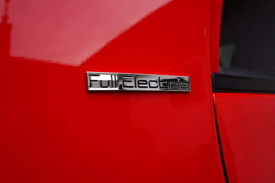 Public domain image - Full Electric badge on electric vehicle