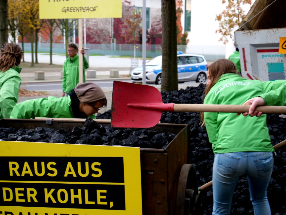 Protest of Greenpeace with coal in front of the German Chancellery 06