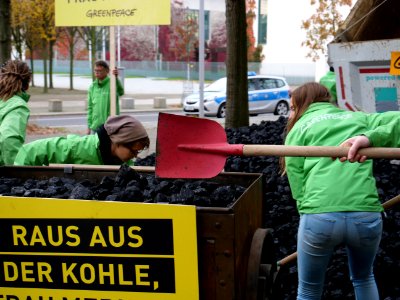 Protest of Greenpeace with coal in front of the German Chancellery 06