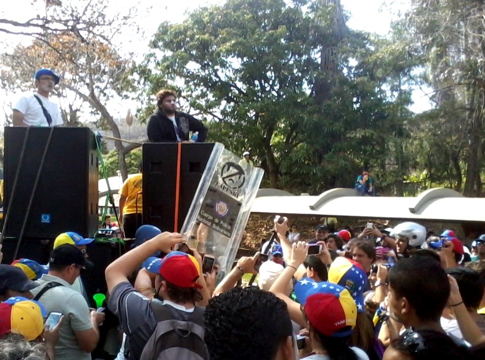 Protester with riot shield Venezuela 2014