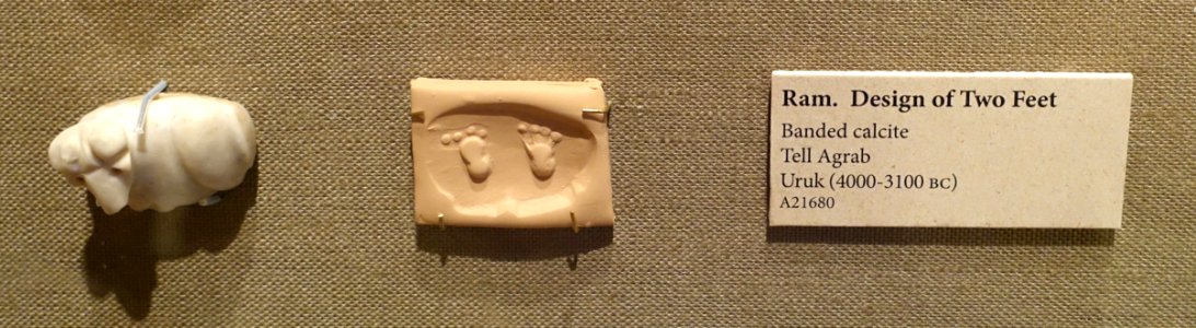 Ram stamp seal with design of two feet, Tell Agrab, Uruk, 4000-3100 BC, banded calcite - Oriental Institute Museum, University of Chicago - DSC07203-001