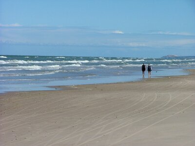 The sea water edge clouds photo