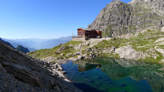 Nature mountain hut water reflection photo