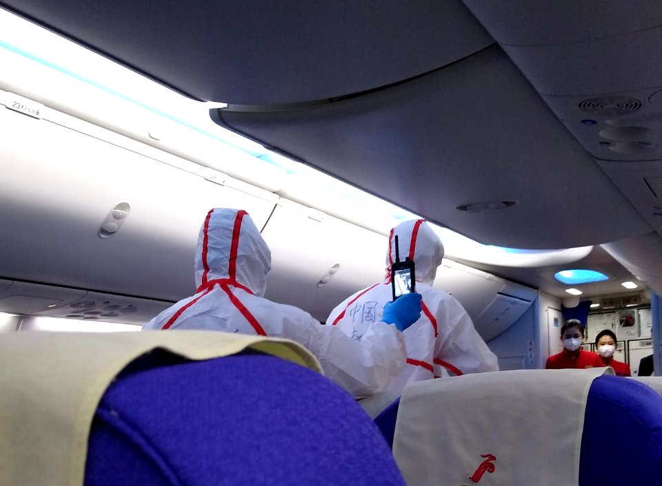 Quarantine staff screening passengers in Shenzhen 2