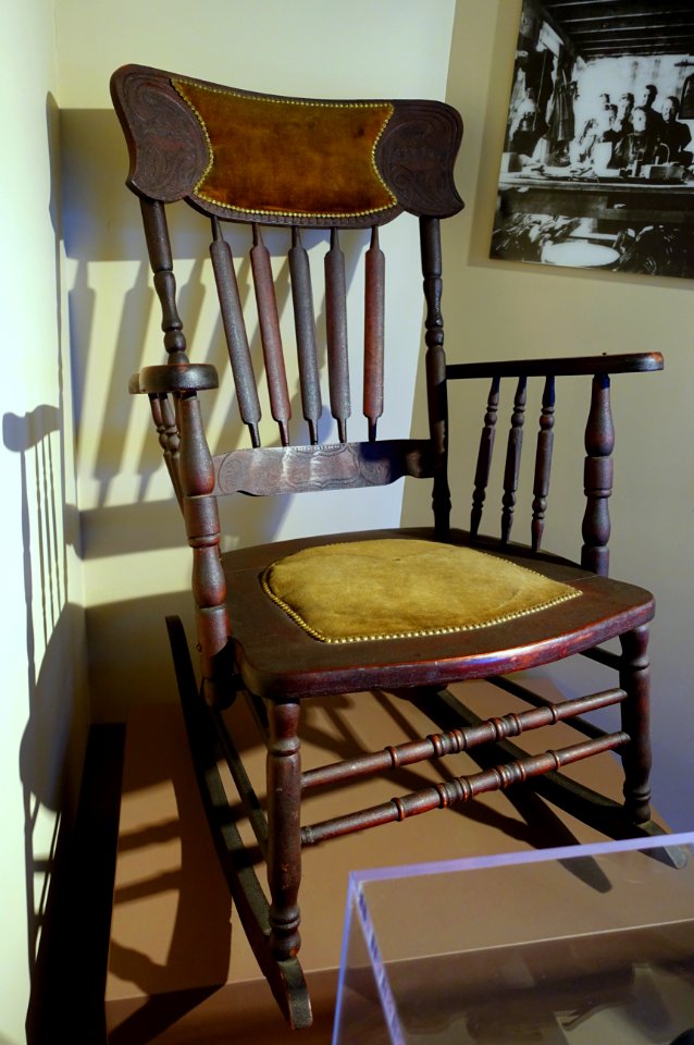 Rocking chair, Allen Chair Company, Concord Junction, 1910-1930, oak, other woods, wool velvet, stamped brass - Concord Museum - Concord, MA - DSC05647