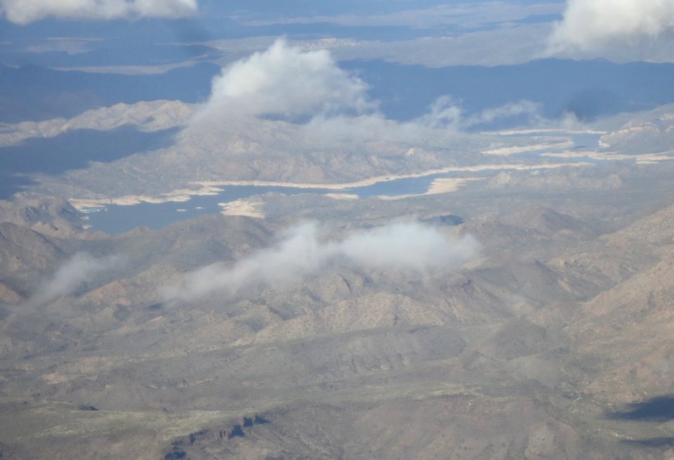 Rocky Mountains with clouds as seen from airplane