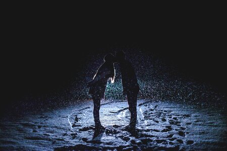 Headlights night kissing couple