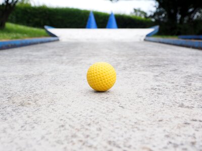 Checkered ball guide miniature golf