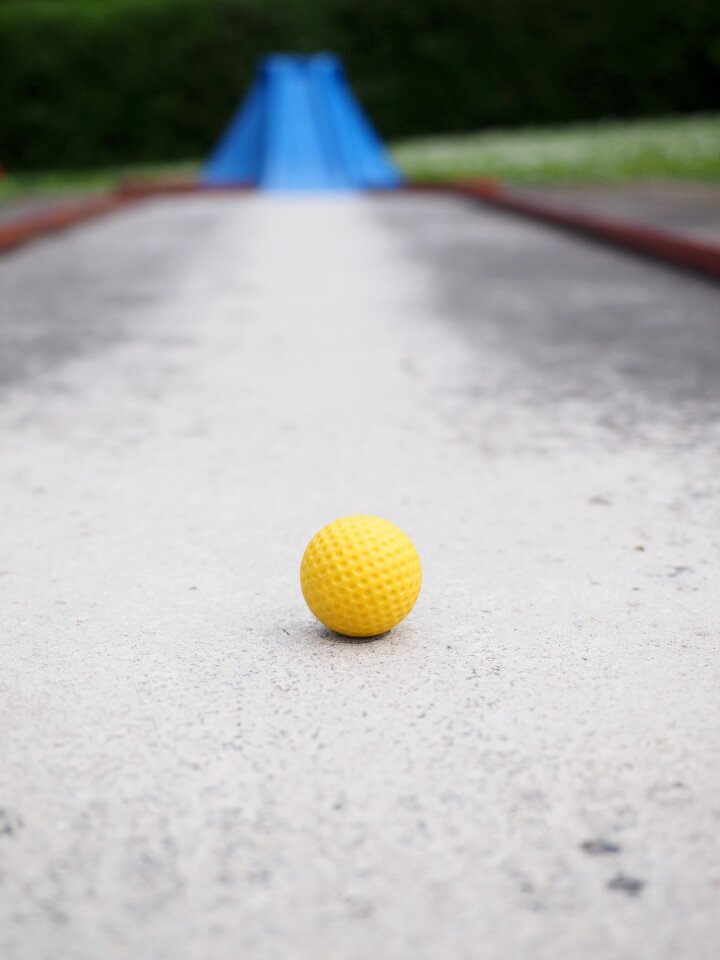 Checkered ball guide miniature golf
