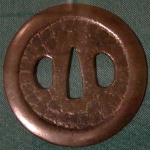 Round sword guard, 14th century, unrefined copper (yamagane)