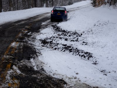 Rough road snowplow and frost damage, New York State Route 421, Adirondacks