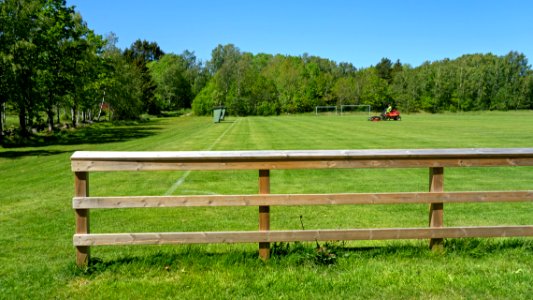 Riding mower in the north soccer field in Brastad 3