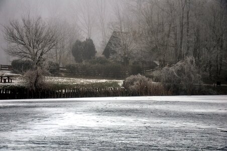 Winter fog frozen lake photo