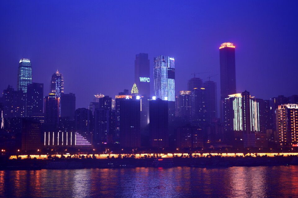 Tall buildings reflection the yangtze river