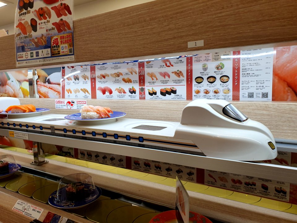 Shinkansen-shaped order delivery conveyor at kaitenzushi restaurant