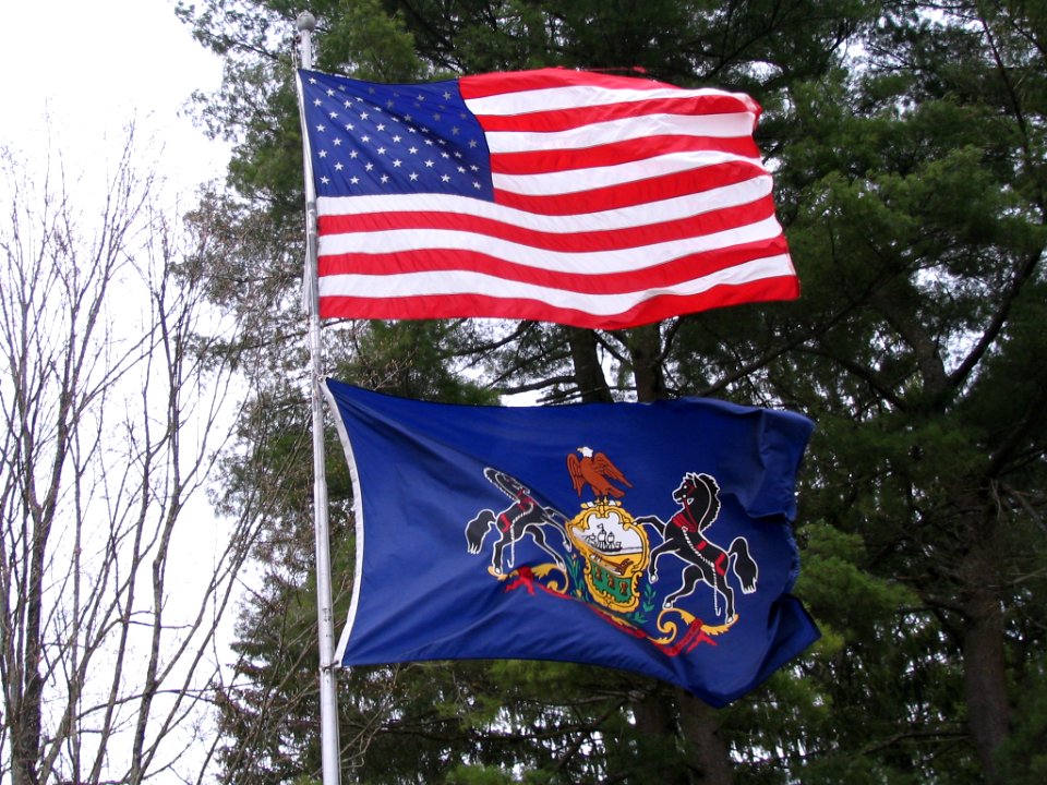 U.S. and Pa. Flags near Lock Lomond Pa. The blue colour on the U.S flag is from the St. Andrews flag on the original U.S. Grand Union flag in 1775