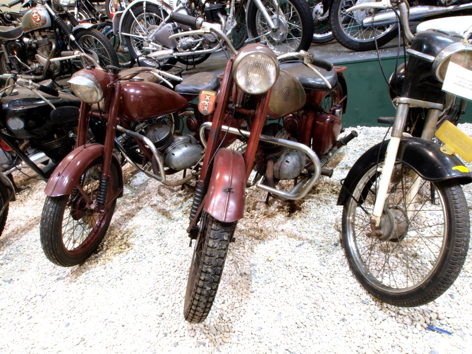 Two red ČZ motorcycles