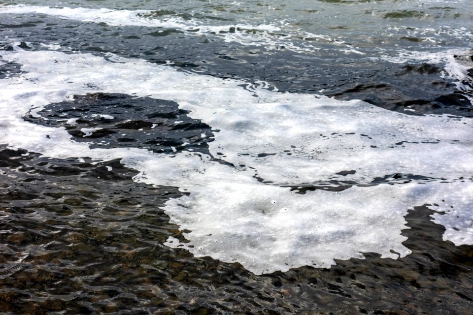 Trail of sea foam in Brofjorden 5 photo