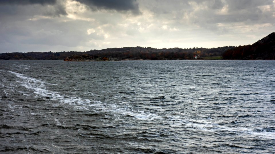 Trail of sea foam in Brofjorden 2 photo