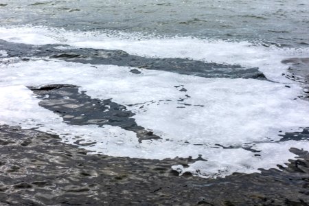 Trail of sea foam in Brofjorden 6 photo