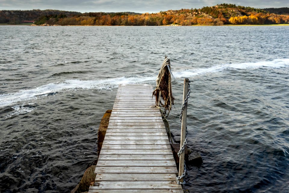 Trail of sea foam by a jetty in Brofjorden 1