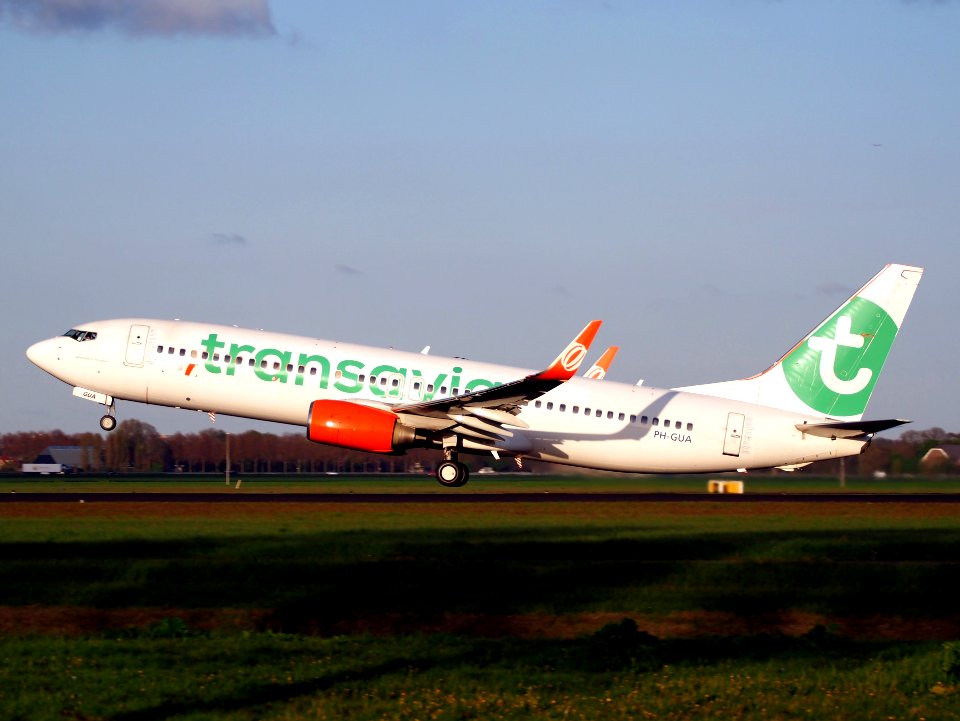 Transavia PH-GUA Boeing 737-800 takeoff from Polderbaan, Schiphol (AMS - EHAM) at sunset, pic1