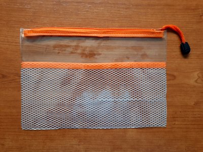 Transparent zipper storage bag with orange zip - 25 x 17 cm - A