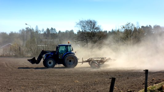 Tractor using a cultipacker in Gåseberg 9 photo