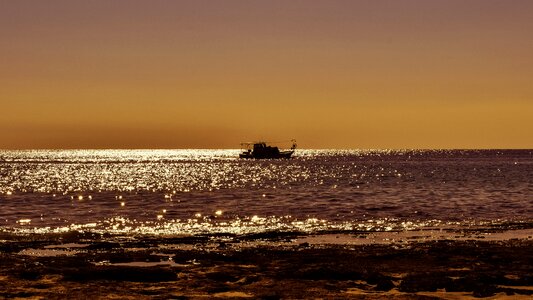 Sunset boat colors photo