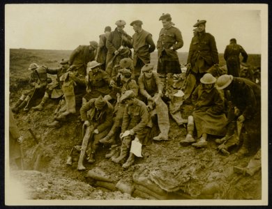 Trying on their rubber trench boots before going into the Front line, Bestanddeelnr 158-0974