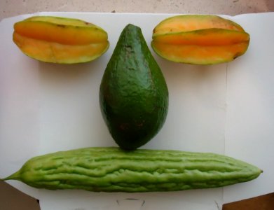Tropical fruits arranged like a face photo