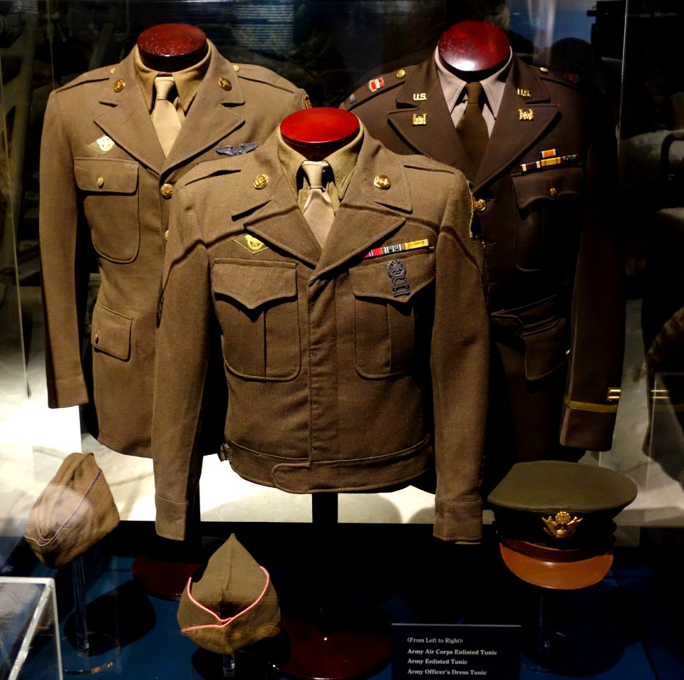 Uniforms (left to right) Army Air Corps Enlisted Tunic, Army Enlisted Tunic, Army Officer's Dress Tunic) - Wisconsin Veterans Museum - DSC03043