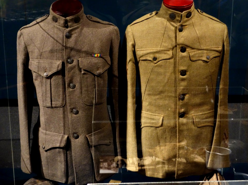 Uniforms, left US Marine Enlisted Forest Green Tunic, right Army Enlisted Tunic Model 1918 - Wisconsin Veterans Museum - DSC03056