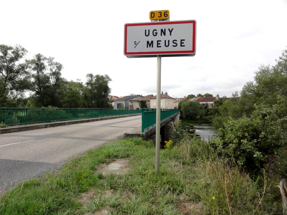 Ugny-sur-Meuse (Meuse) city limit sign and Meuse bridge