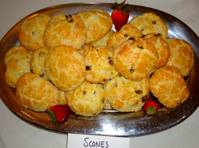 UU Scones with strawberries on a silver plate