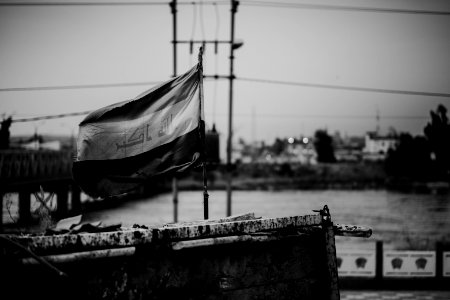 Views of Iraqi flag over the Aghawat Mosque in Mosul in summer of 2019, after its destruction in the war with the Islamic State 13