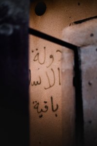 Views of "Long live Islamic State" graffiti around the ruined ID card office in Shingal in April of 2019, following war with the Islamic State 24