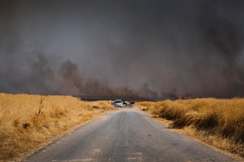 Views of fires spreading in summer of 2019 across villages near Shingal, being put out by Ezidi volunteers 08