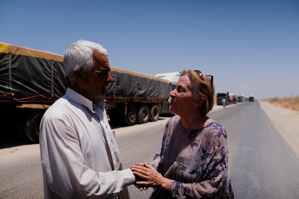 Views of a line of trucks from Arab cities in Iraq, waiting to enter the grain depot in Sinjar 03