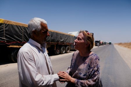 Views of a line of trucks from Arab cities in Iraq, waiting to enter the grain depot in Sinjar 03