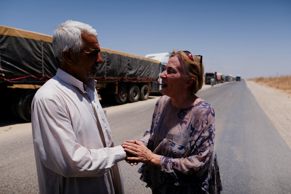 Views of a line of trucks from Arab cities in Iraq, waiting to enter the grain depot in Sinjar 02