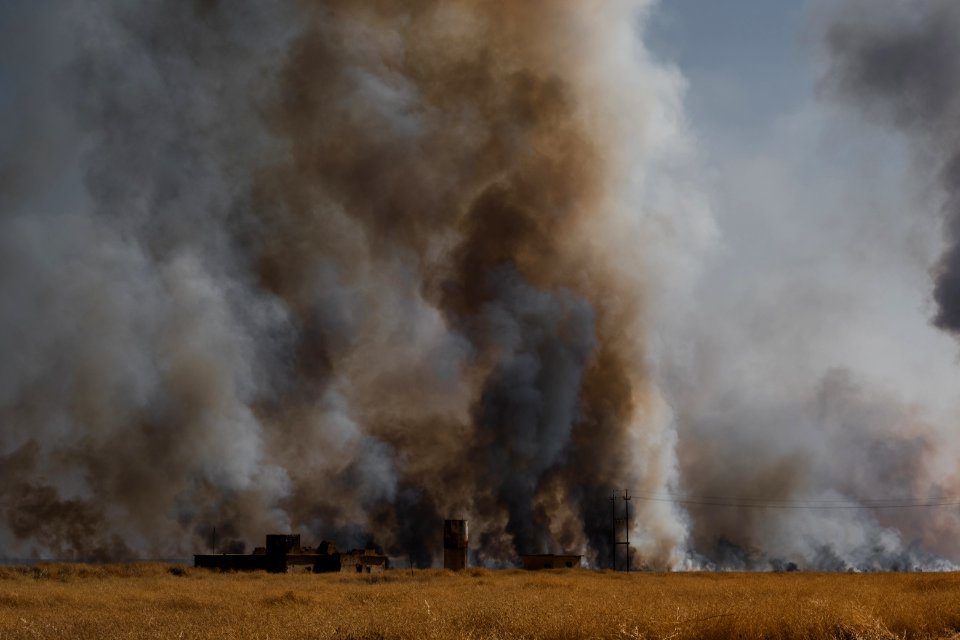 Views of fires spreading in summer of 2019 across villages near Shingal, being put out by Ezidi volunteers 11