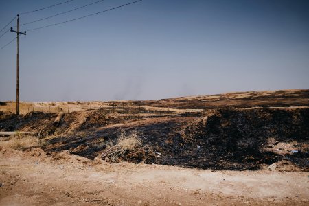 Views of fires that destroyed a mass grave of Ezidis killed by ISIS in summer of 2019 in Sinjar 10
