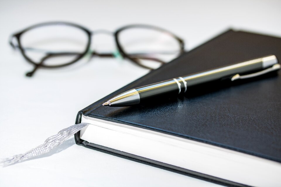 Closed the agenda of lying ribbon bookmark