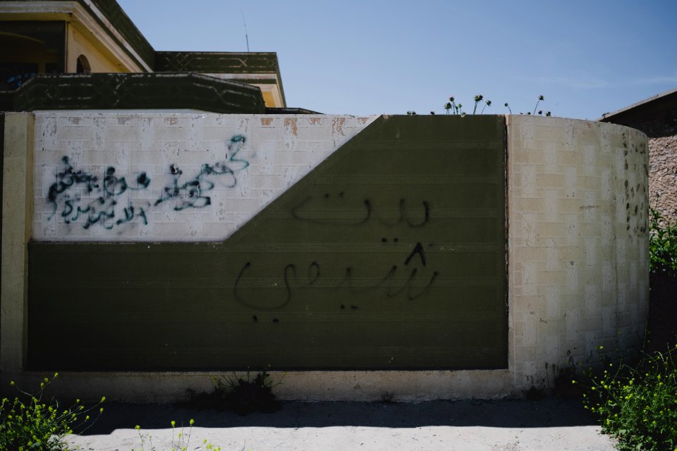 Views around the city center during April of 2019 showing a house with "Shia House" graffiti from the Islamic State in Shingal city 21
