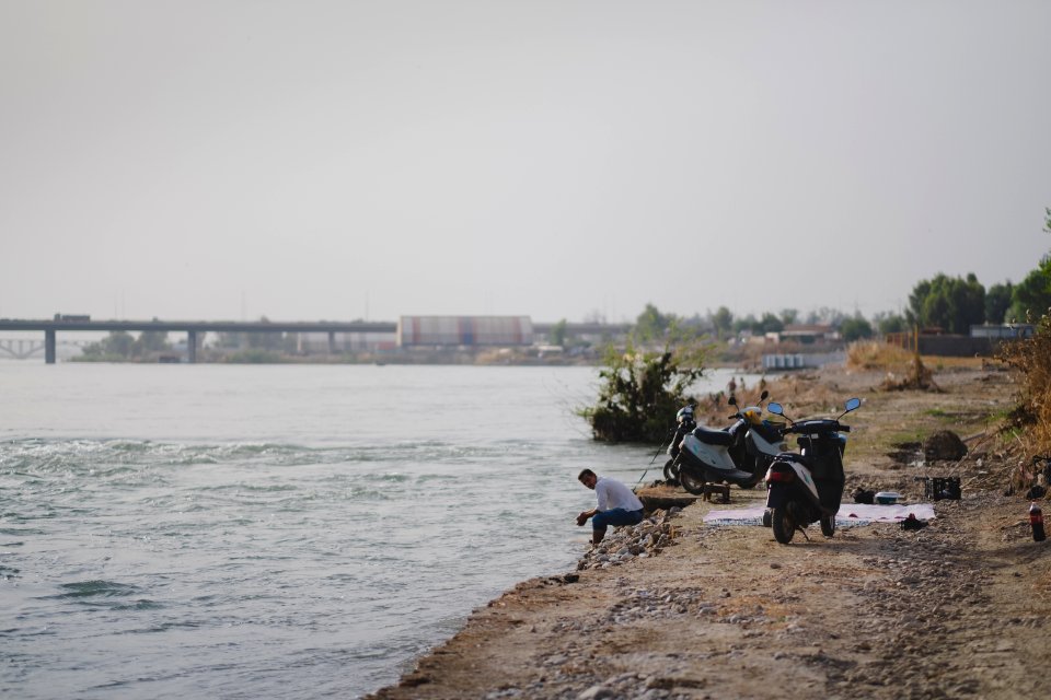 Views along the river Tigris in Mosul in 2019 when Moslawis go during the summer to cool down 13