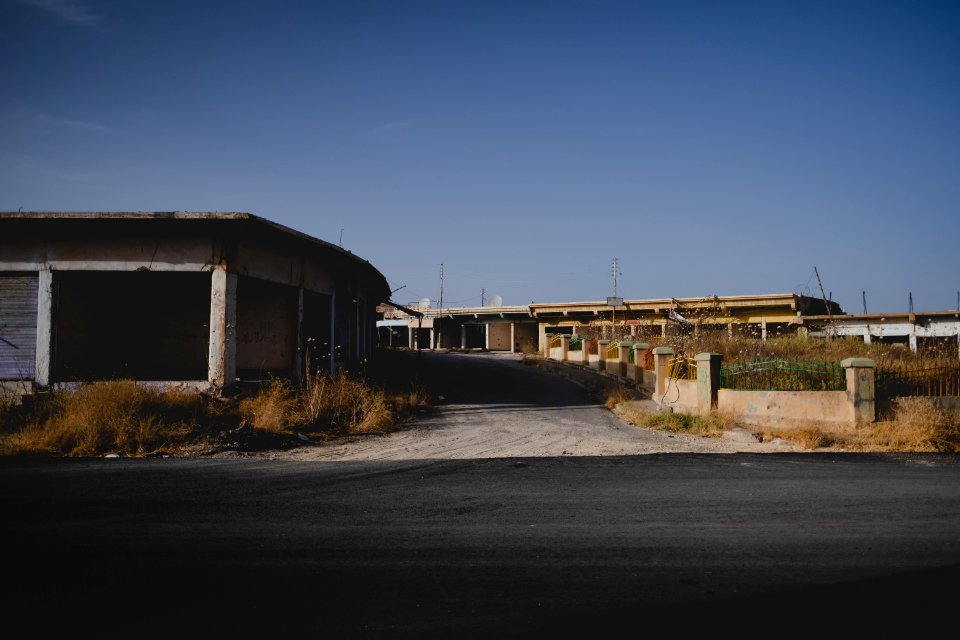 Views in June of 2019 of ruined buildings around the center of Shingal (Sinjar) town 03