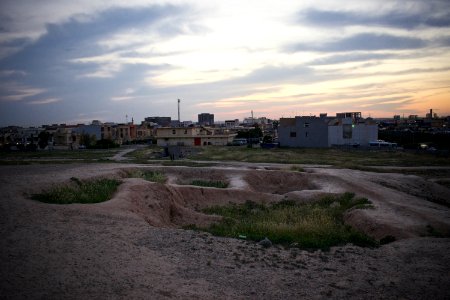Views of pottery sherds, previous excavation sites, and the mound itself at 'Kelik Mishik' archaeological mound in Erbil 26