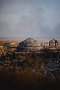 Views in June of 2019 of a cathedral rising above ruined buildings in the old neighborhood of Shingal (Sinjar) 19