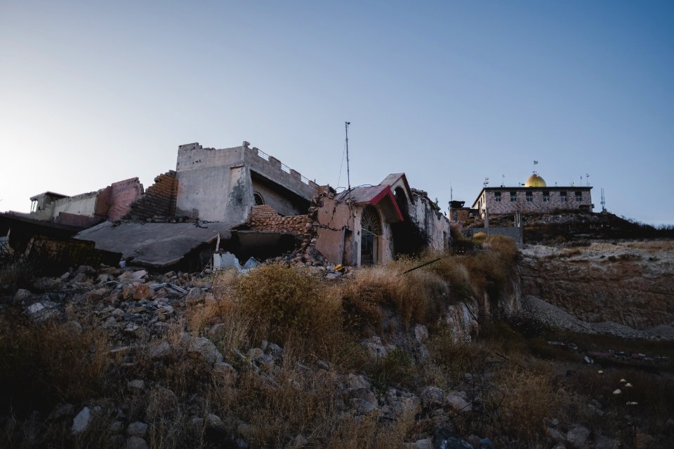 Views in June of 2019 of ruined buildings around the center of Shingal (Sinjar) town 36